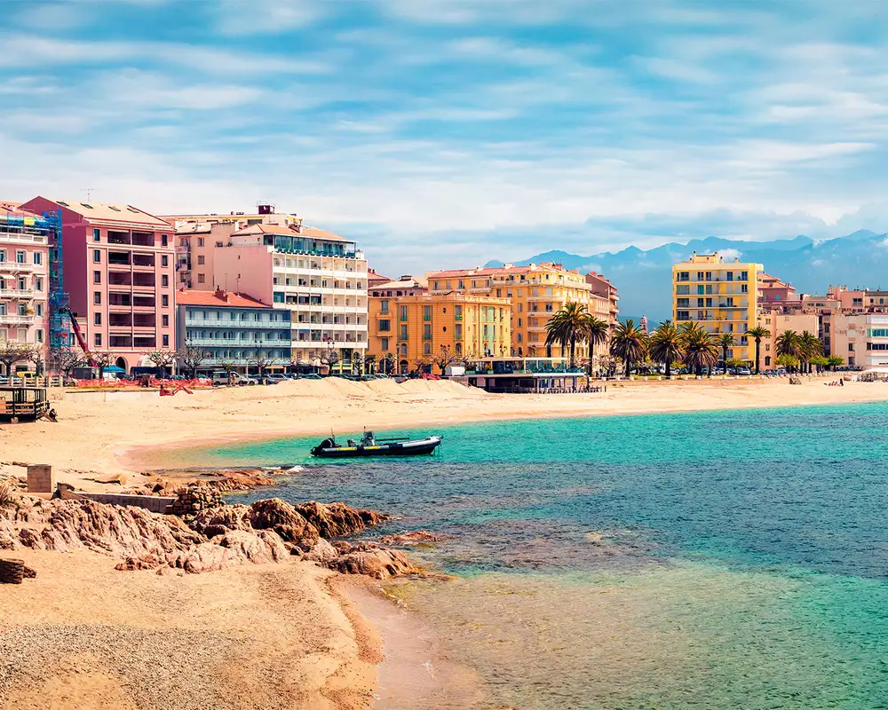 An image of colourful houses on the shore of a Mediterranean City