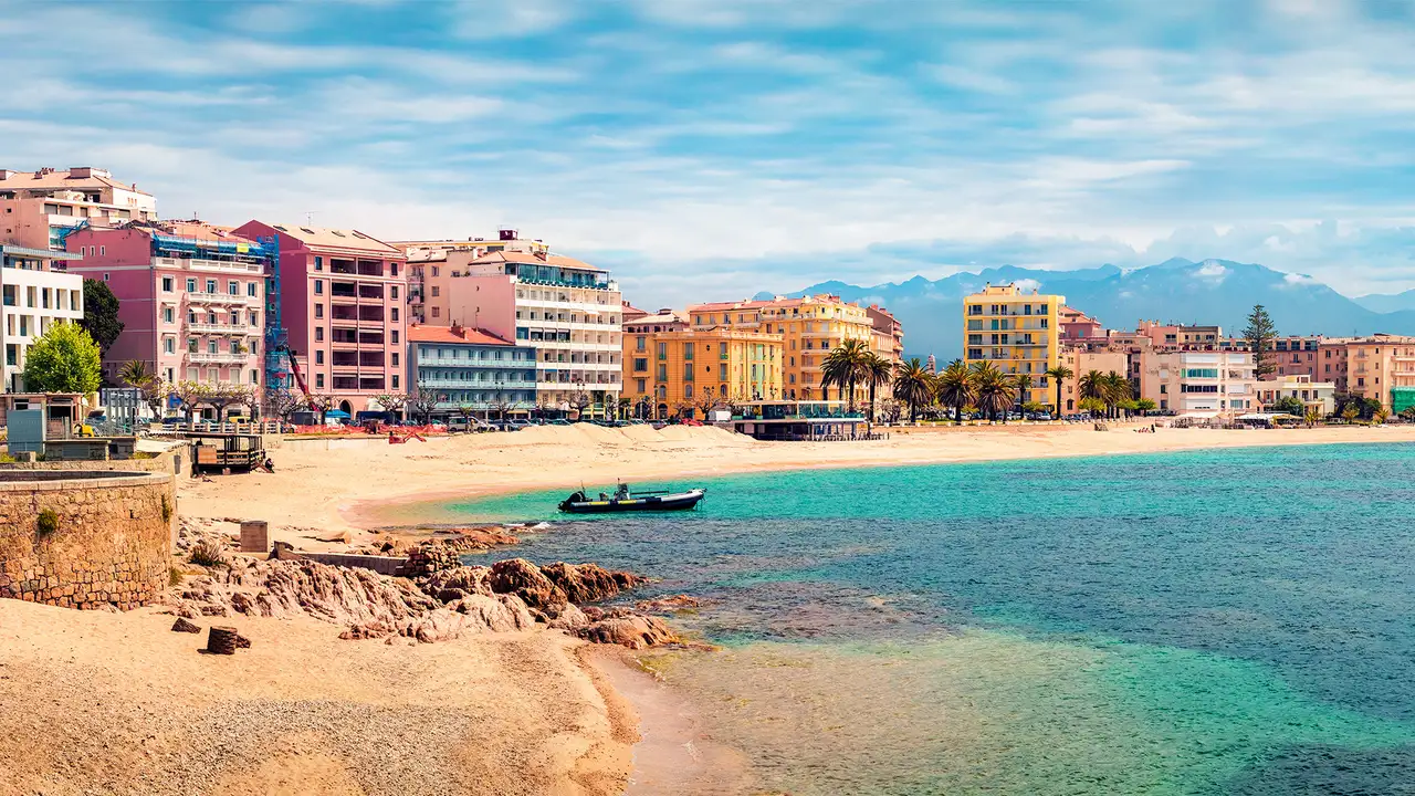 An image of colourful houses on the shore of a Mediterranean City