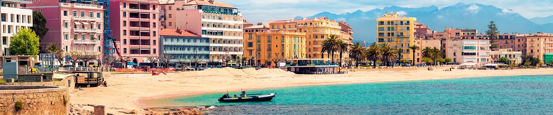 An image of colourful houses on the shore of a Mediterranean City