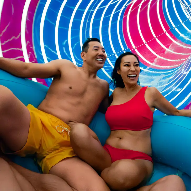 A Couple riding the Supercell waterslide onboard a Royal Caribbean ship