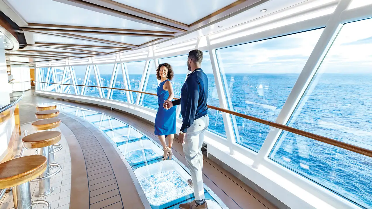A Couple walking through a SkyWalk present on Princess Ships