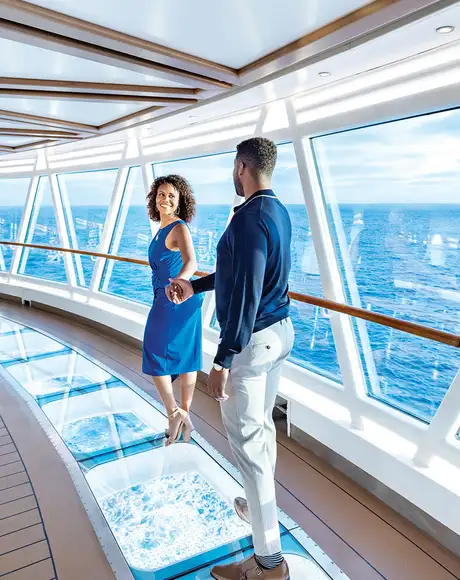 A Couple walking through a SkyWalk present on Princess Ships
