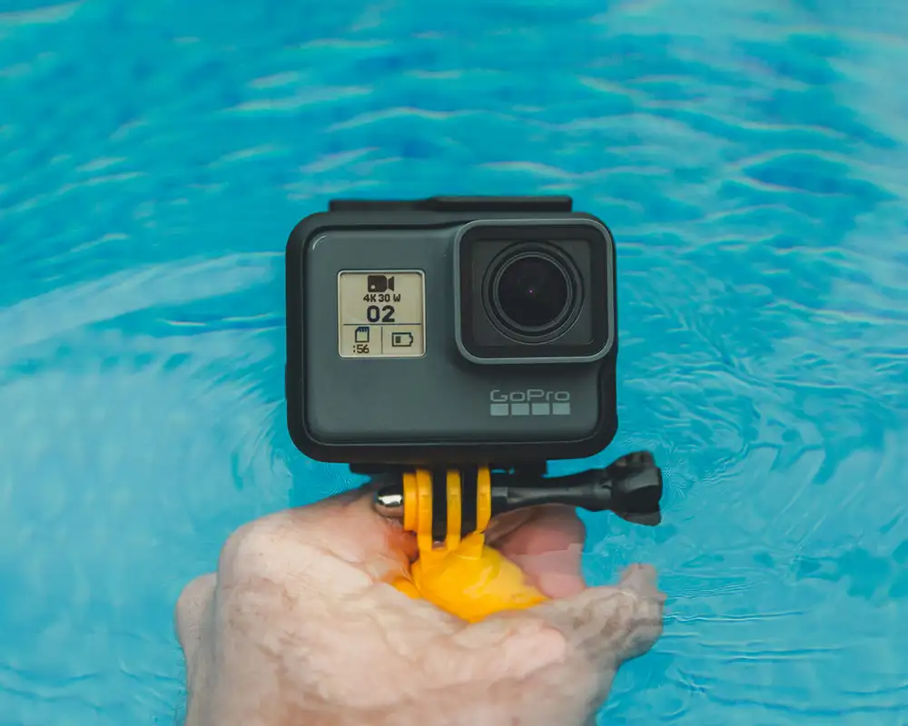 A Waterproof GoPro Camera being lowered into a pool