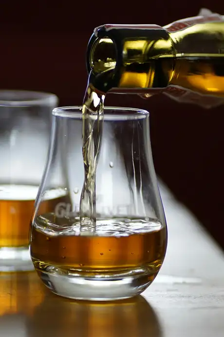 Whiskey being poured into a glass