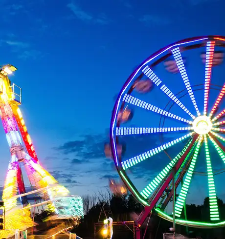 A fairground at night