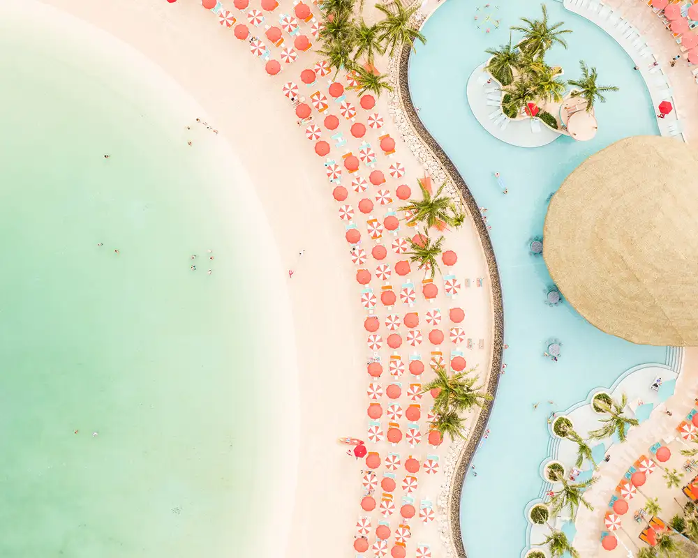 A Pool close to a beach on Cococay
