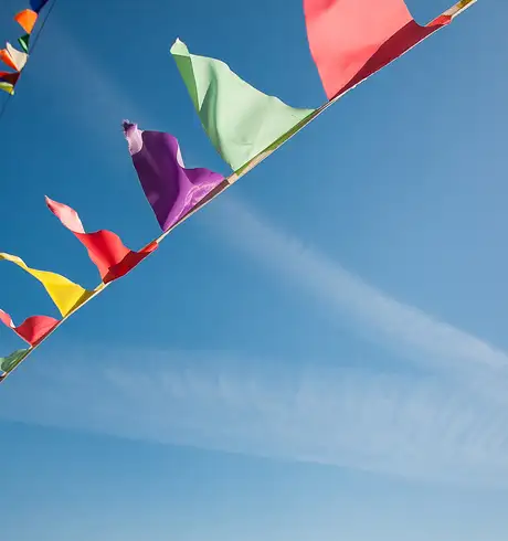 Multicoloured Flags against the blue sky