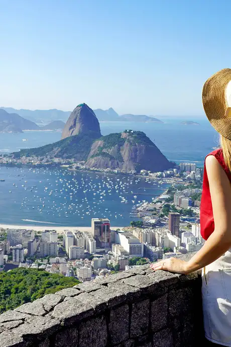 A Woman looking over Rio de Janerio from a height