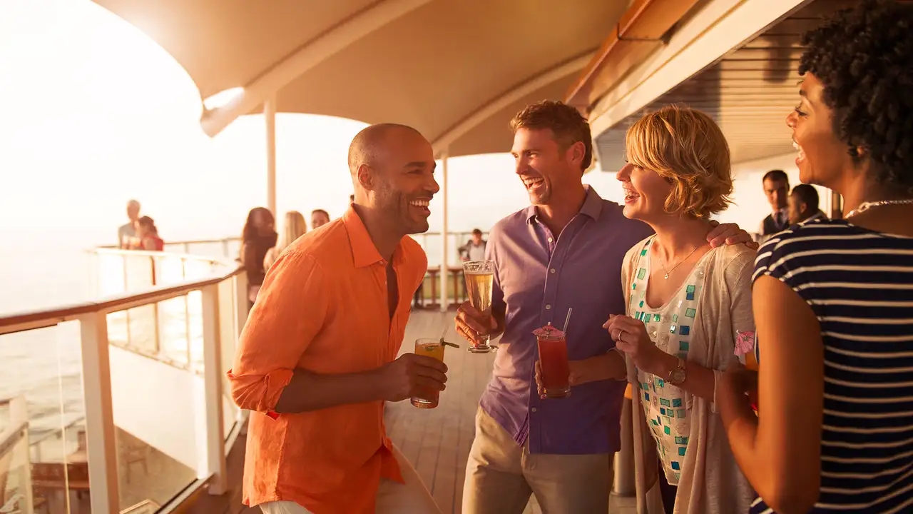 A group of Friends laughing and enjoying drinks