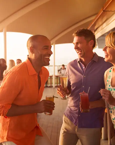 A group of Friends laughing and enjoying drinks