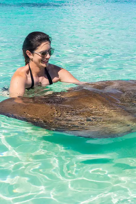 A Woman sitting with a Stingray