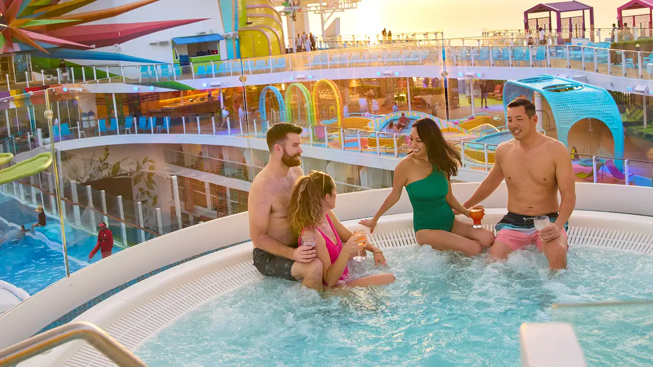 A group of friends relaxing in a hot tub aboard a Royal Caribbean ship