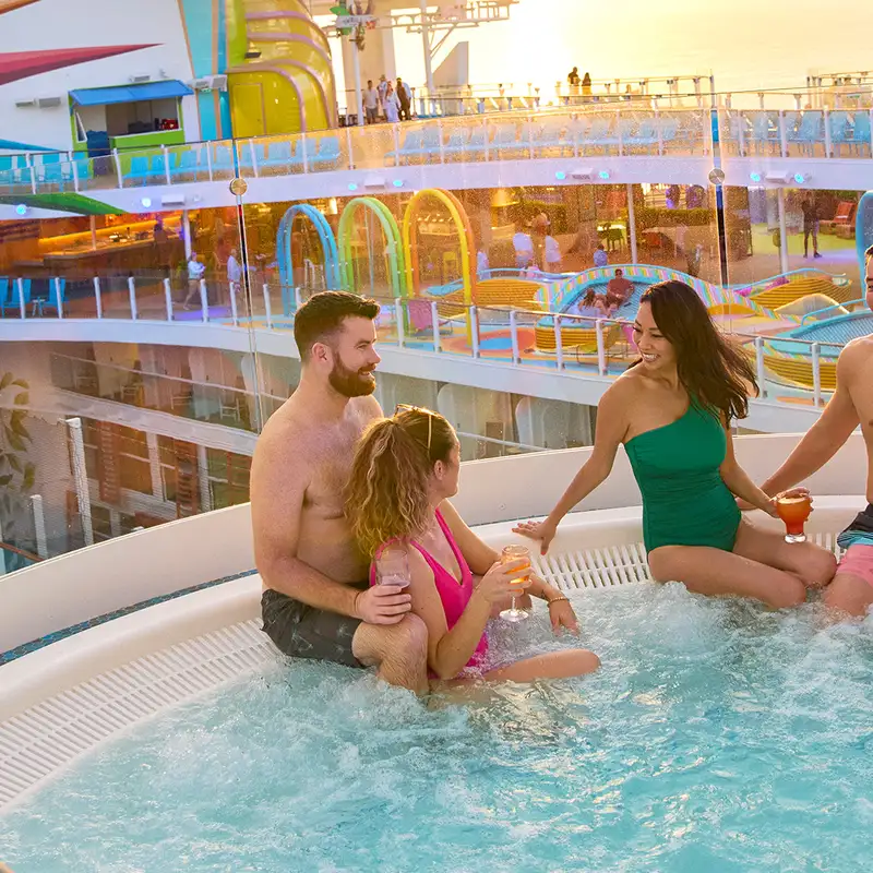 A group of friends relaxing in a hot tub aboard a Royal Caribbean ship