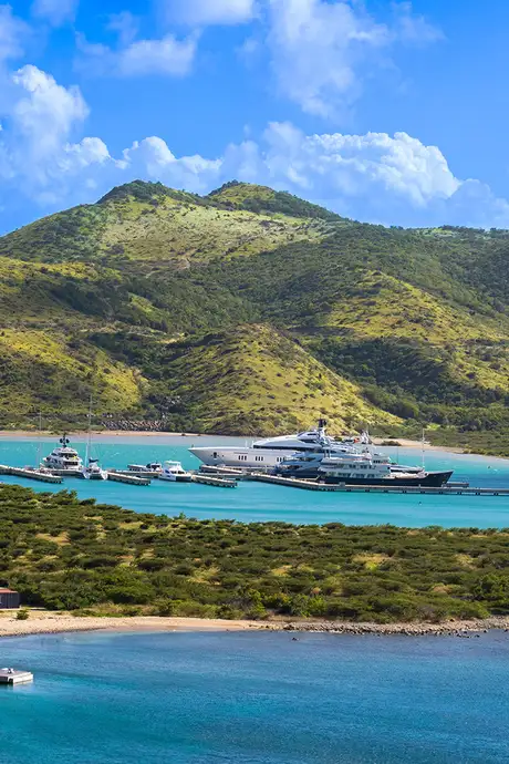 A View of the Landscape of Basseterre with a Dock and docked boats being visible