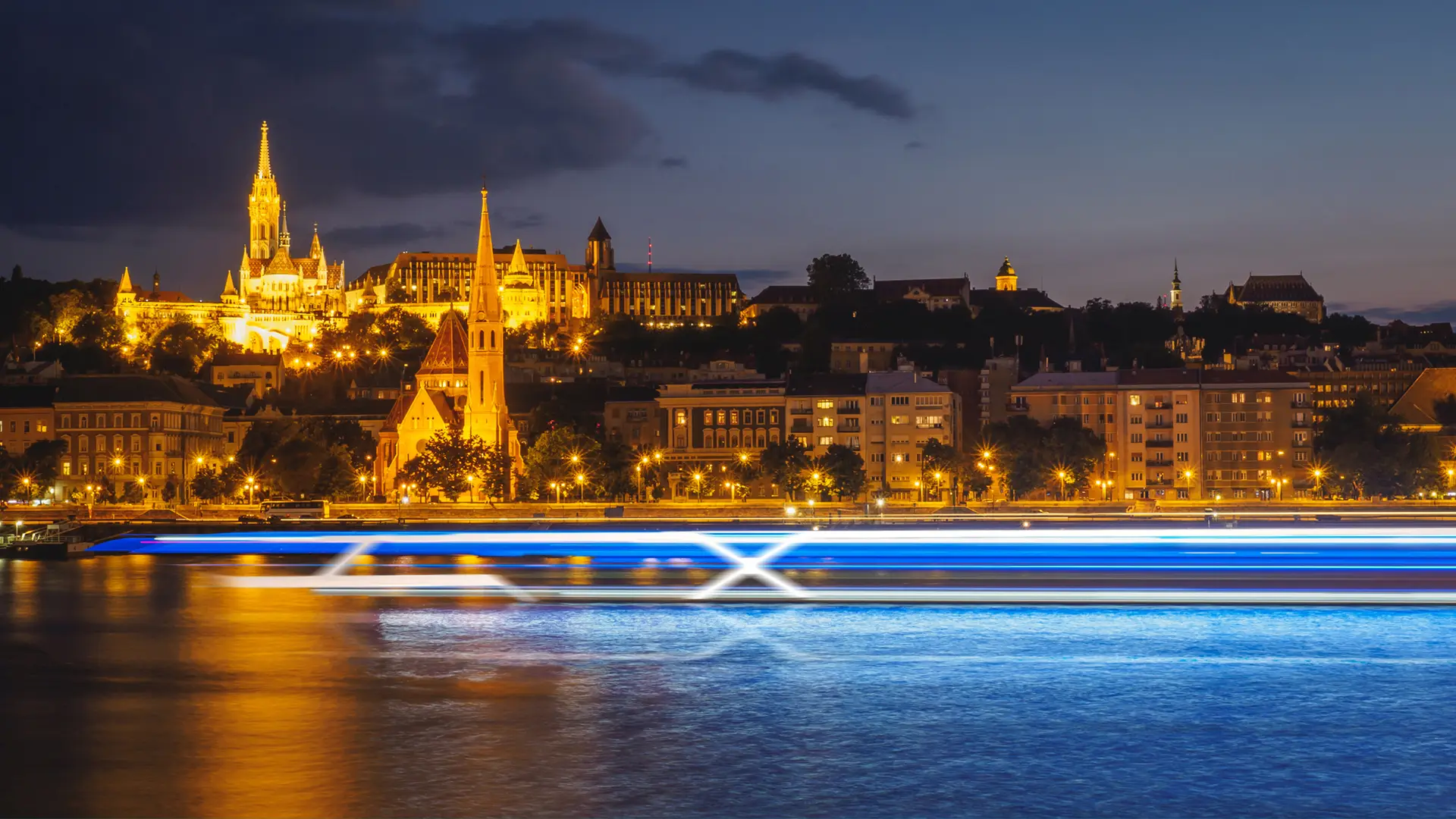 A View of a River at Night with a blur of the Celebrity Compass