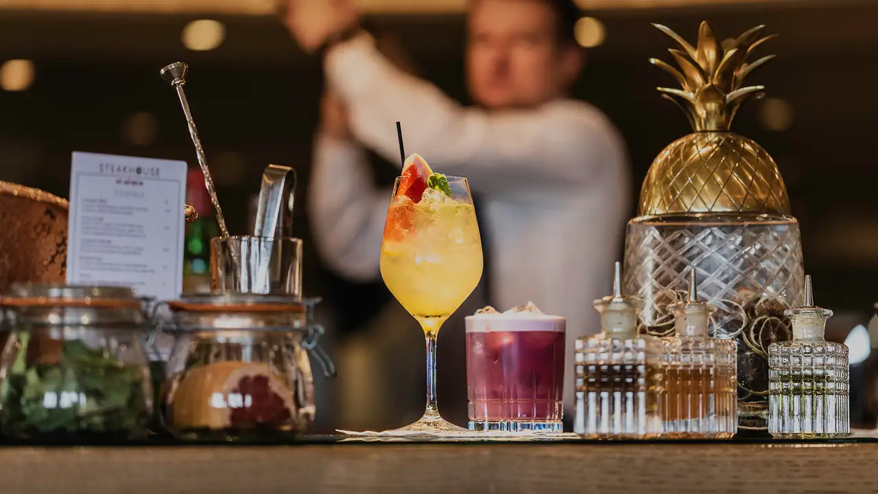 A Bartender making drinks on a Cunard Ship