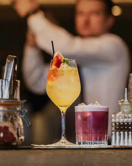 A Bartender making drinks on a Cunard Ship