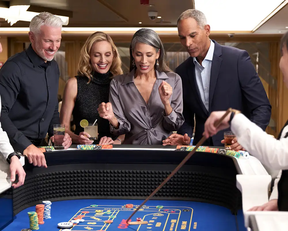 People playing on a Roulette table in a casino aboard an Oceania Ship