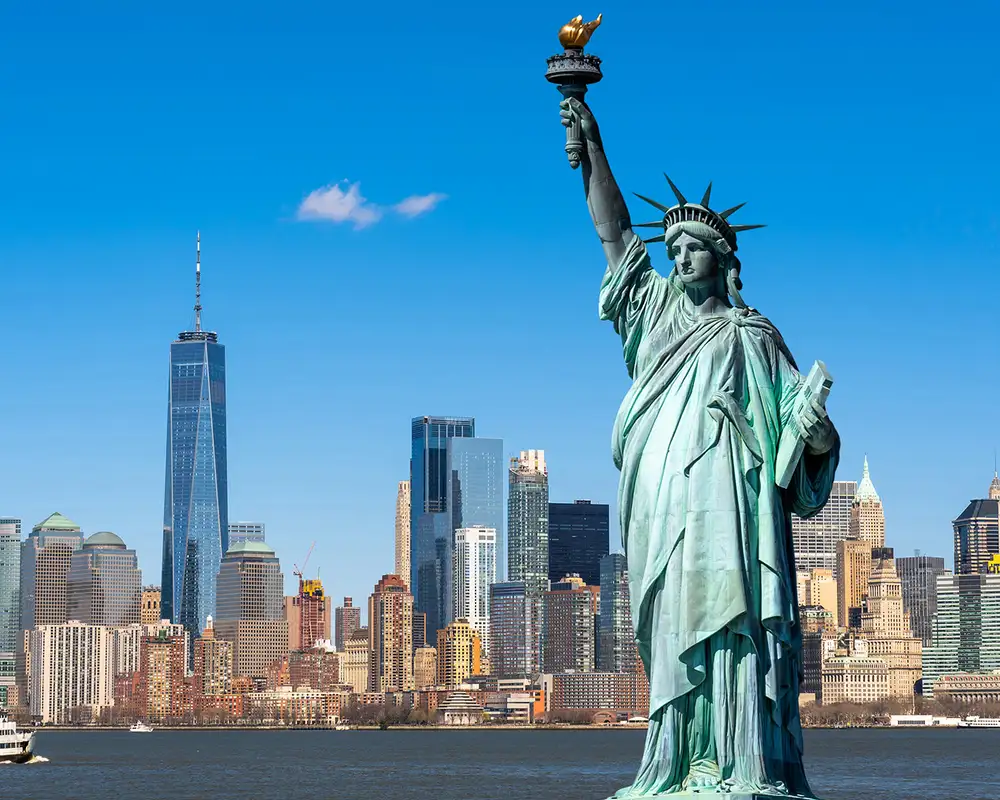 The skyline of New York with the Statue of Liberty in the foreground