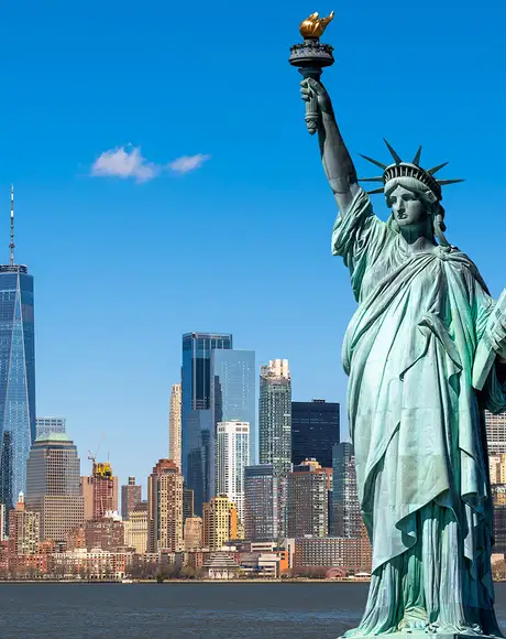 The skyline of New York with the Statue of Liberty in the foreground