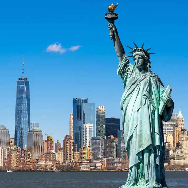 The skyline of New York with the Statue of Liberty in the foreground