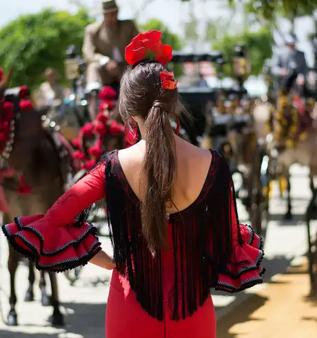 A woman in black and red at Barcelona's Carnival