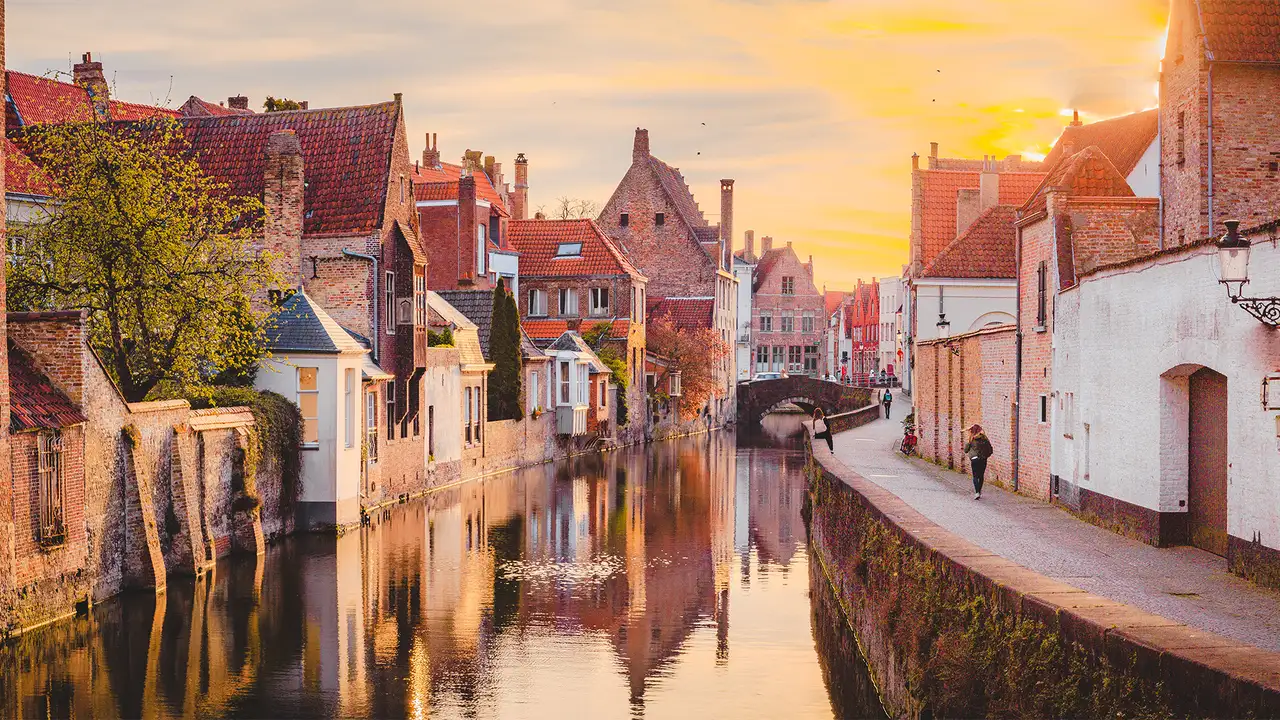 The sun setting over a river in Zeebrugge, Belgium