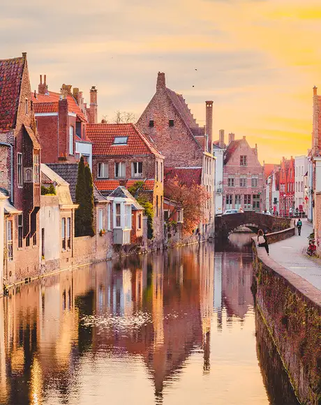 The sun setting over a river in Zeebrugge, Belgium