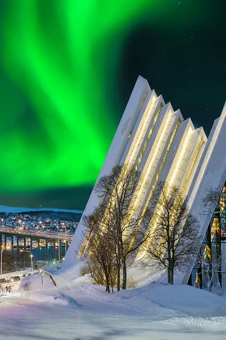 A View of the Snowy Landscape of Tromso, Norway under the Northern Lights