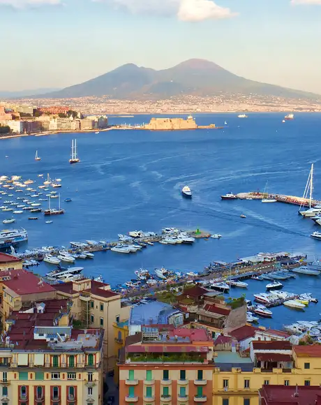 A view of Naples from above, with Mount Vesuvius in the distance