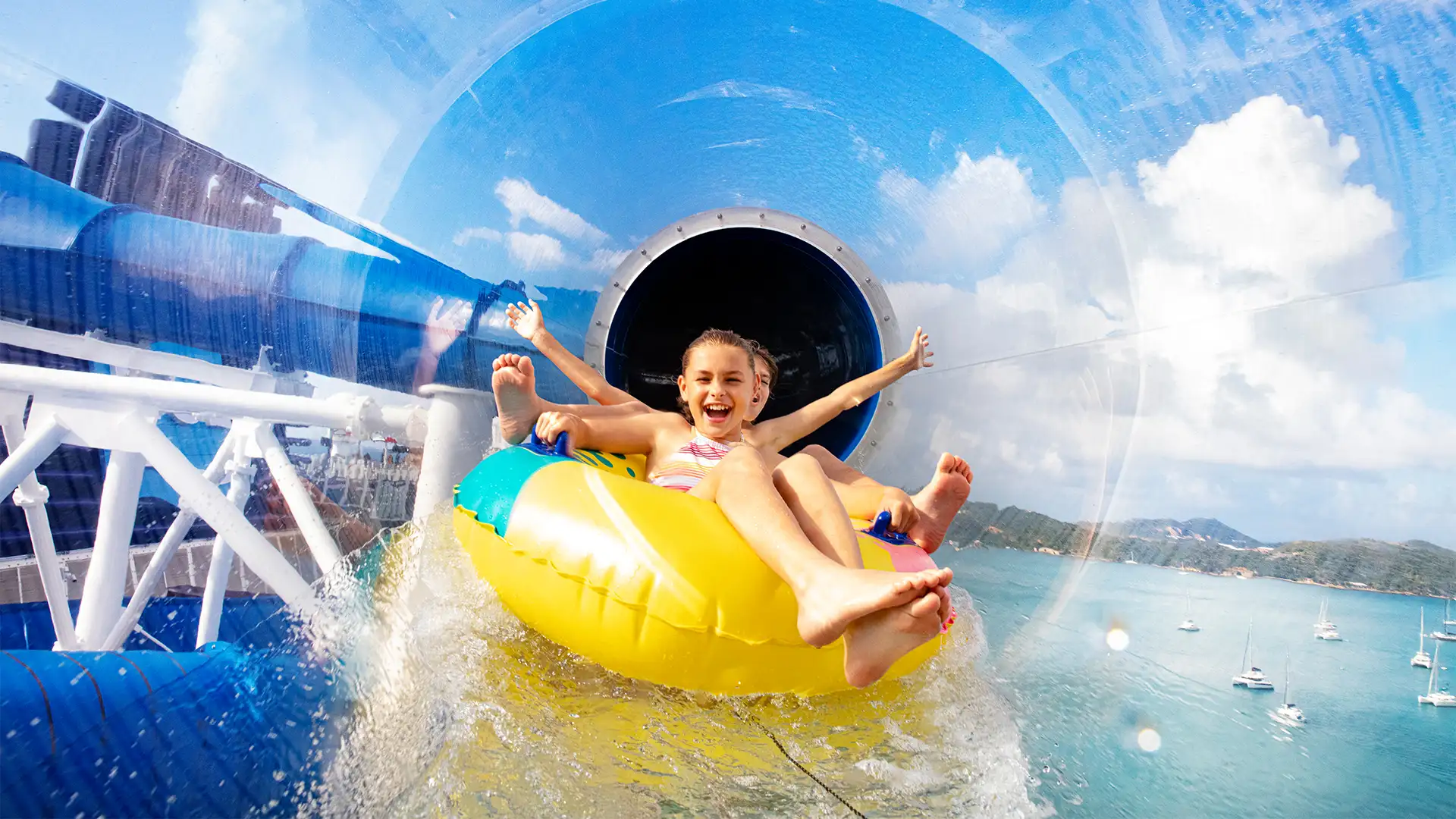 Children going down a water slide