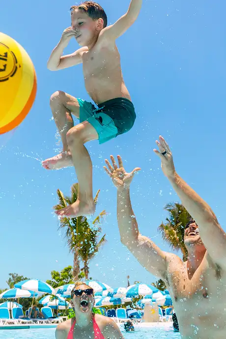 A family playing in the pool of Oasis Lagoon on Cococay