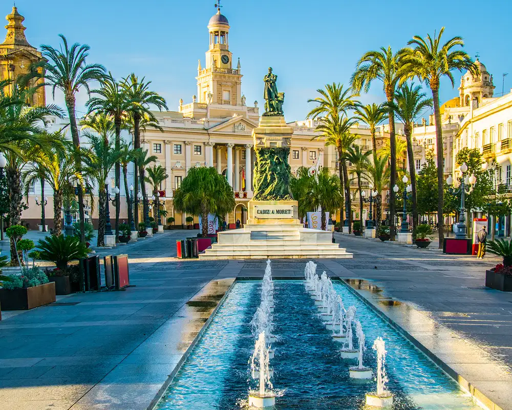 A View of a Town Square with a Statue and Fountain in Cadiz, Spain