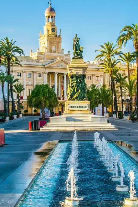 A View of a Town Square with a Statue and Fountain in Cadiz, Spain