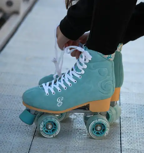 A Person putting on Roller Blades
