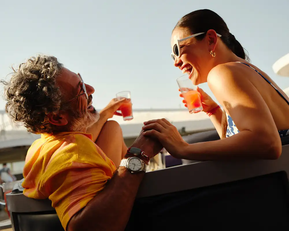 A Couple enjoying drinks onboard Virgin Voyages