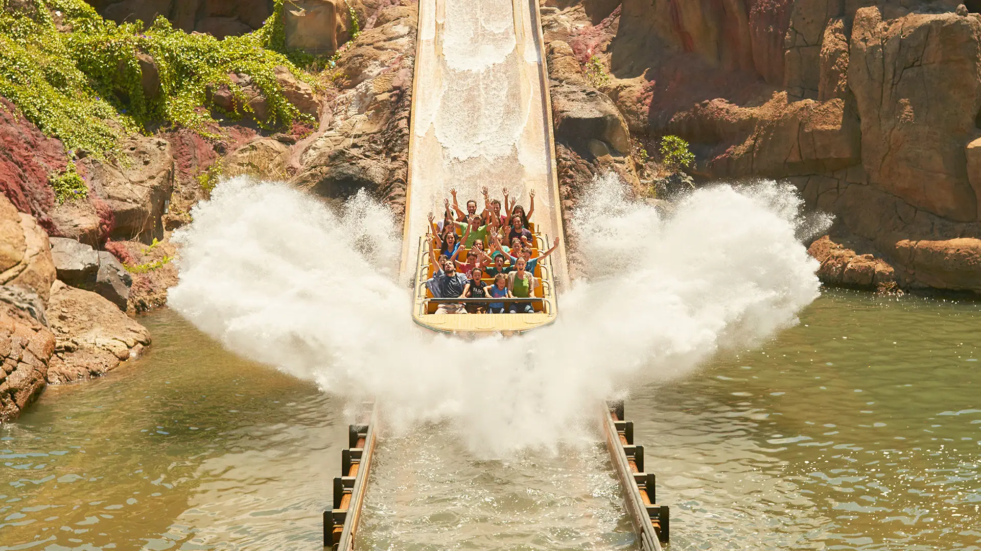 A Group of people riding a large log flume ride