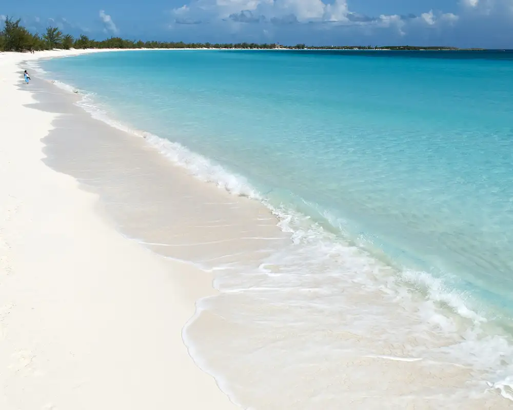 A Sunny beach with white sand and crystal clear water on Half Moon Cay