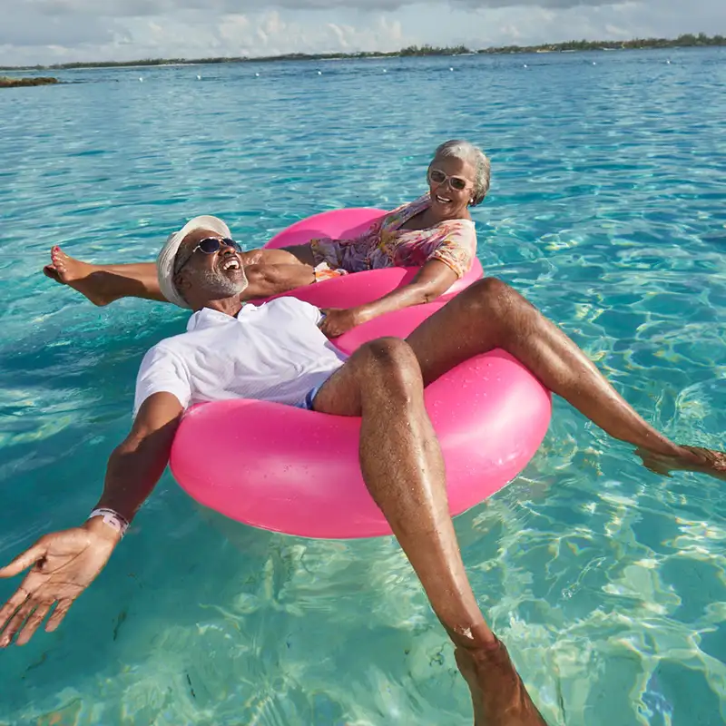 A Couple floating in the ocean on a Carnival Cruise