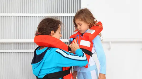 People putting on life jackets