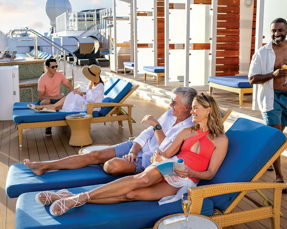 People relaxing on the sundeck of an NCL ship