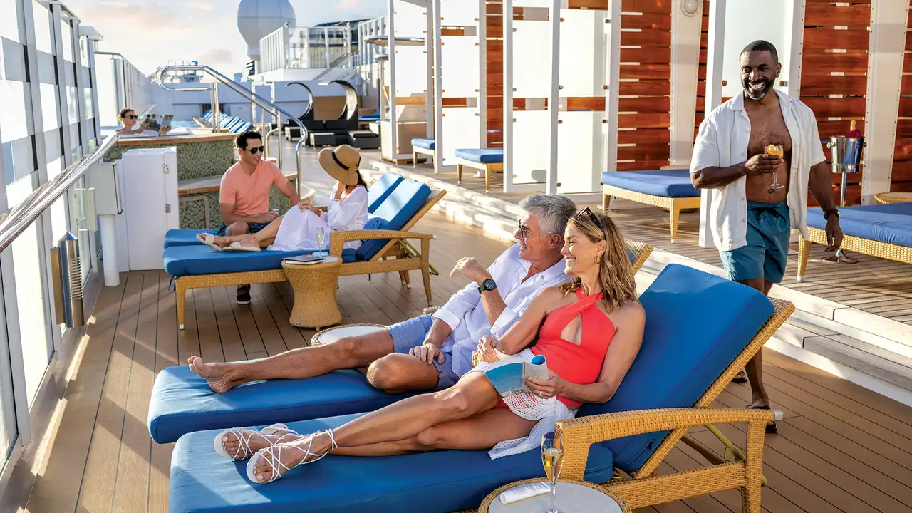 People relaxing on the sundeck of an NCL ship