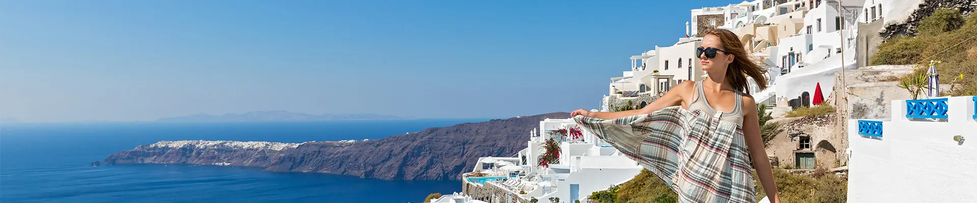 A Woman walking the streets of Santorini