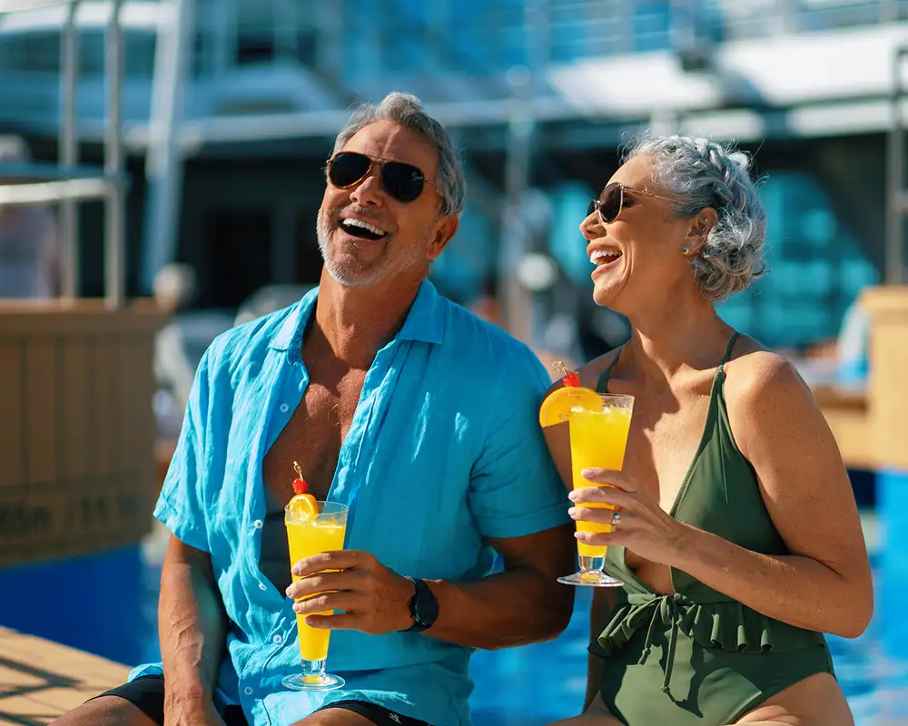 A couple enjoying drinks aboard an Azamara Cruise Ship