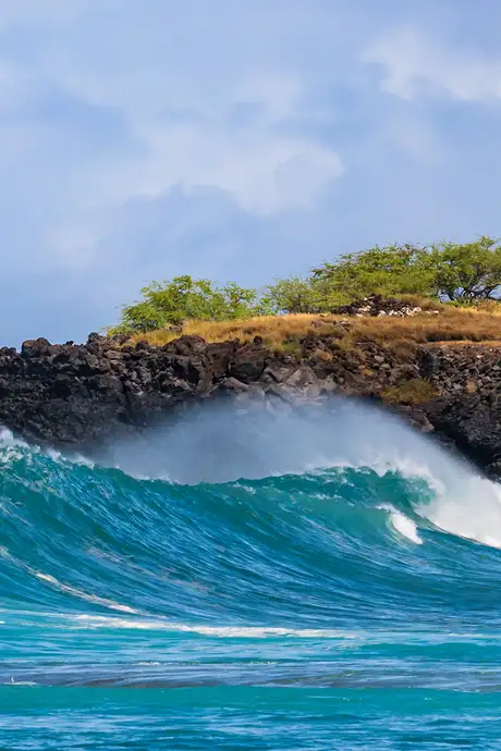 A View of waves crashing on a cliff in Kona, Hawaii