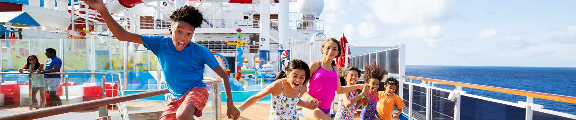 A group of Children running on the deck of a Carnival Ship