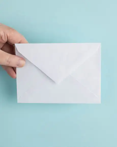 A Hand holding an Envelope