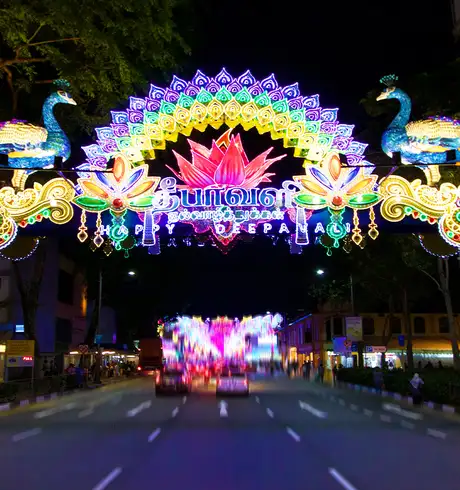 A neon sign promoting a festival