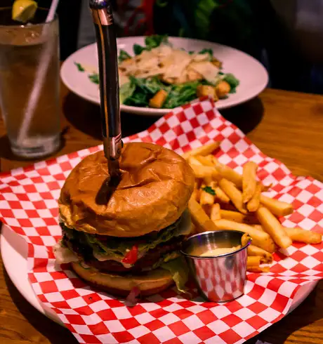A burger and chips offered by Hard Rock Cafe