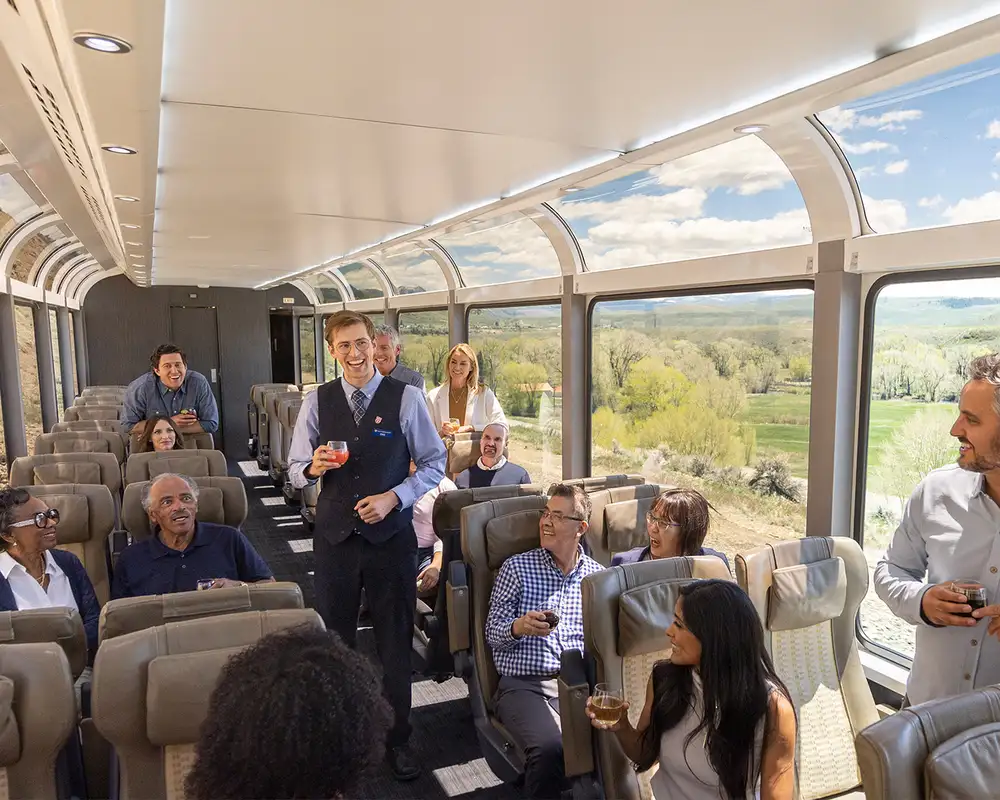 Staff and Passengers enjoying drinks on the Rocky Mountaineer